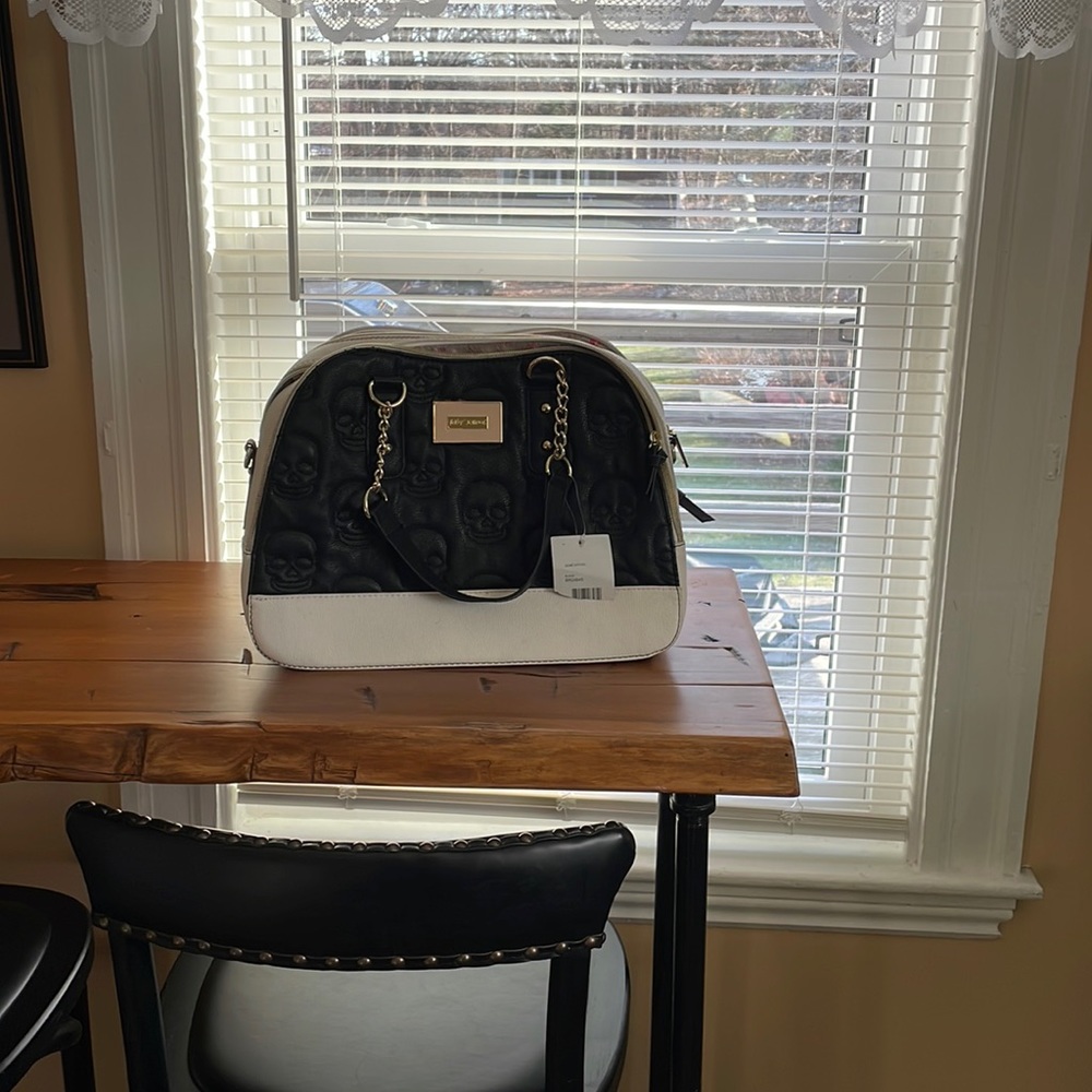 Betsy skull dome satchel. Never used. 2 tiny imperfections noted .